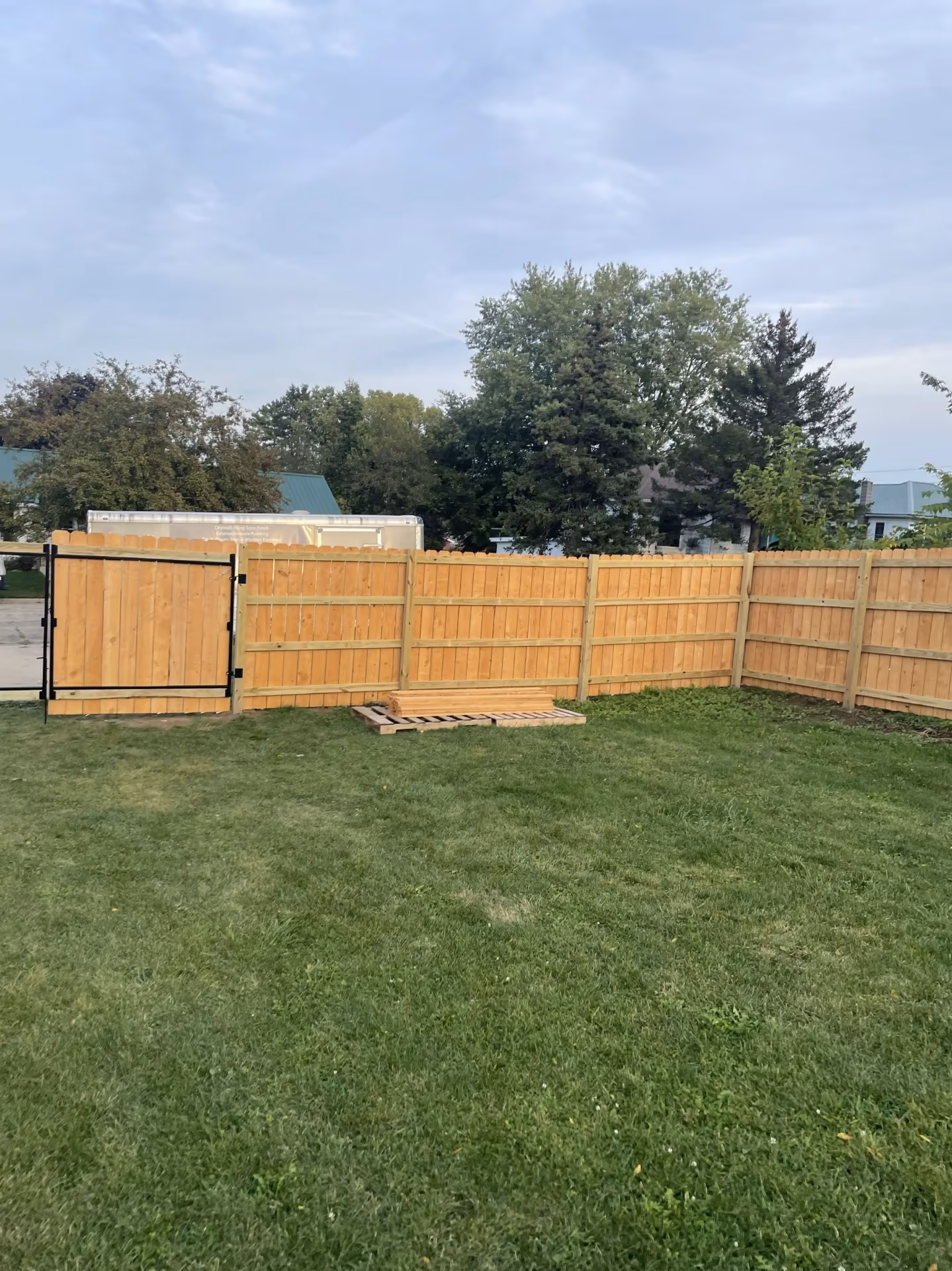 Completed wood privacy fence with gate